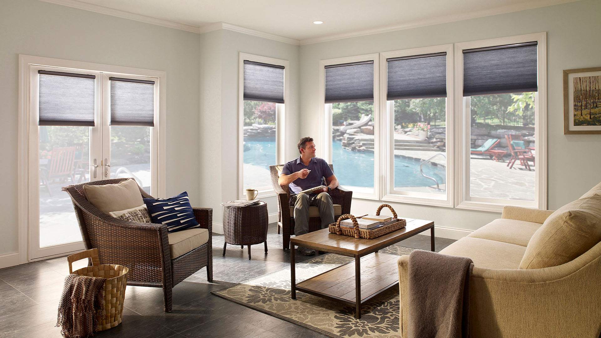 A man relaxes in his custom home thanks to a smart technology integrator